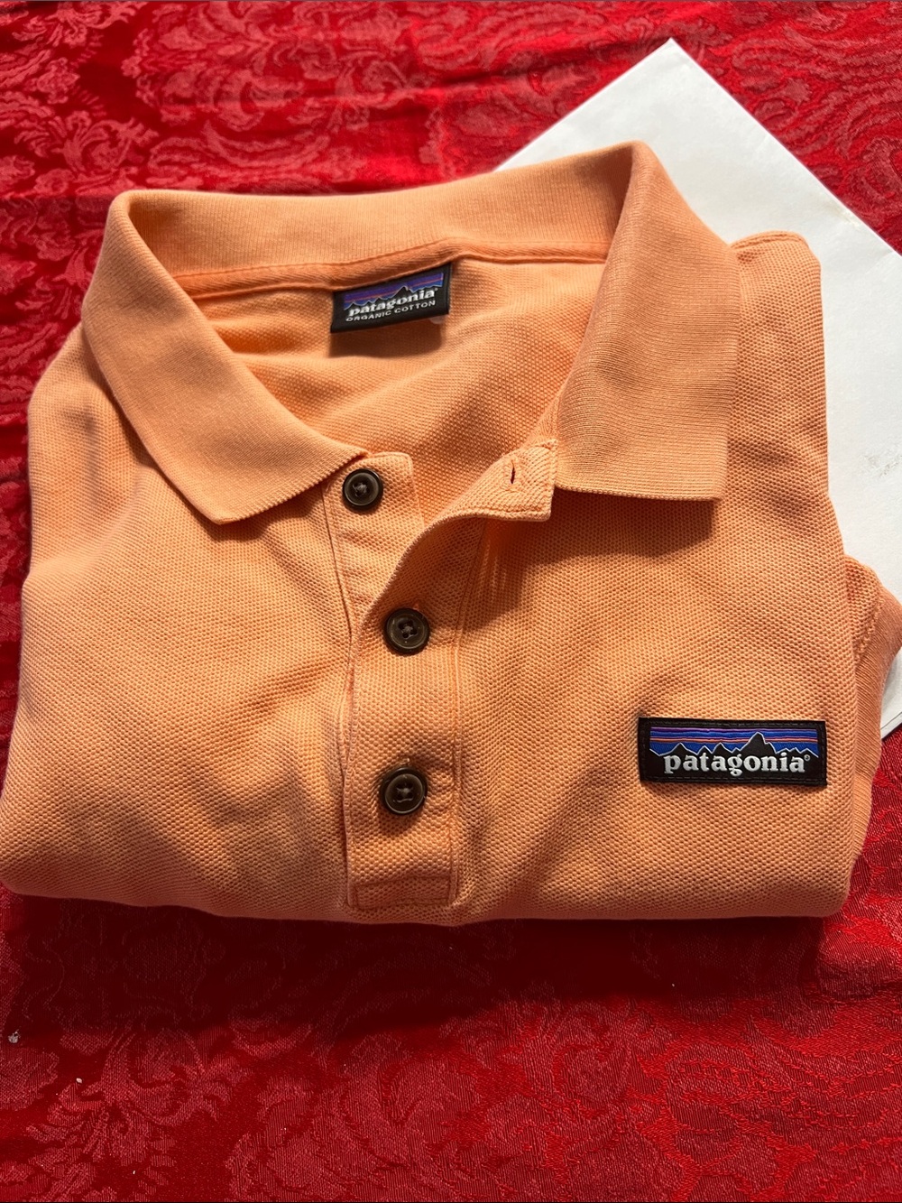 Patagonia Menās Orange Organic Cotton Polo Shirt 22ā PTP Logo Patch